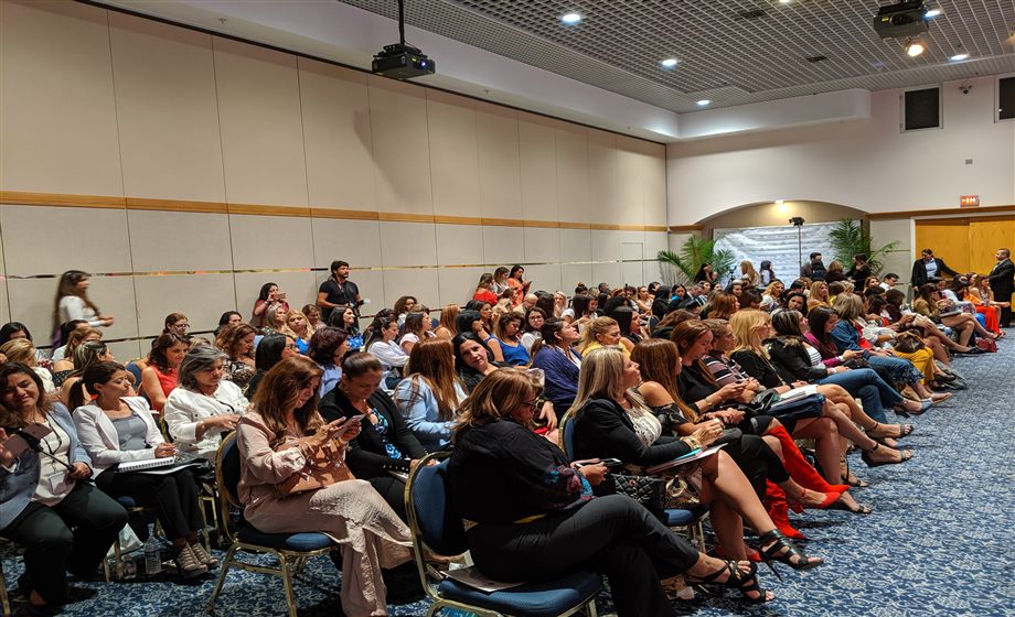 Professional women engaged in a RUTA™ workshop — faces visible, active learning environment